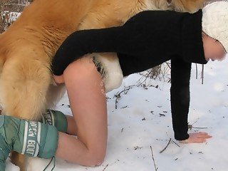 Woman takes pants down and invites dog to own her pussy in snows